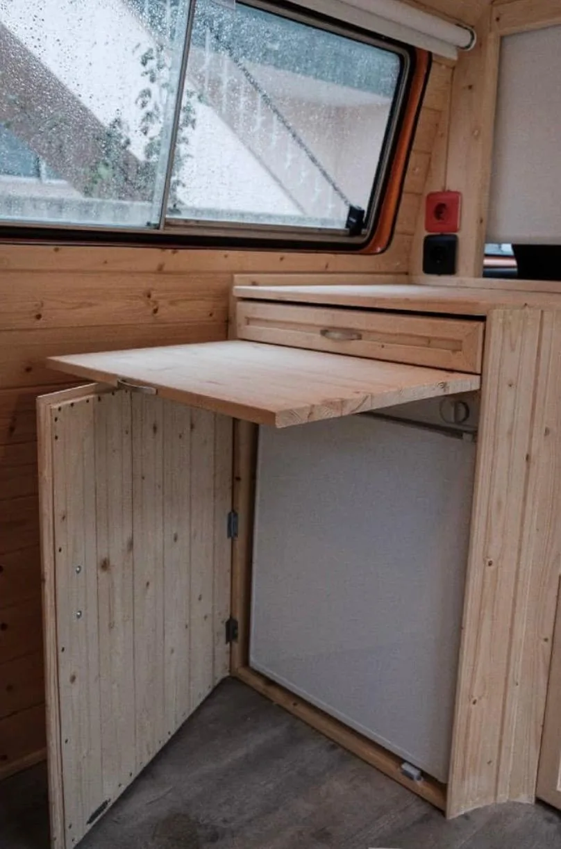 Solid wood fold-out table open by the window