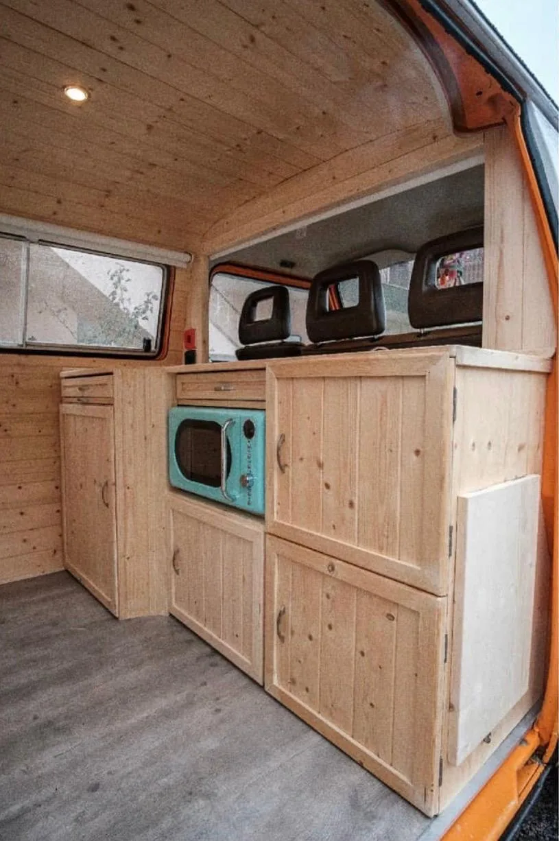 Wide kitchen view with the front seats visible in the background