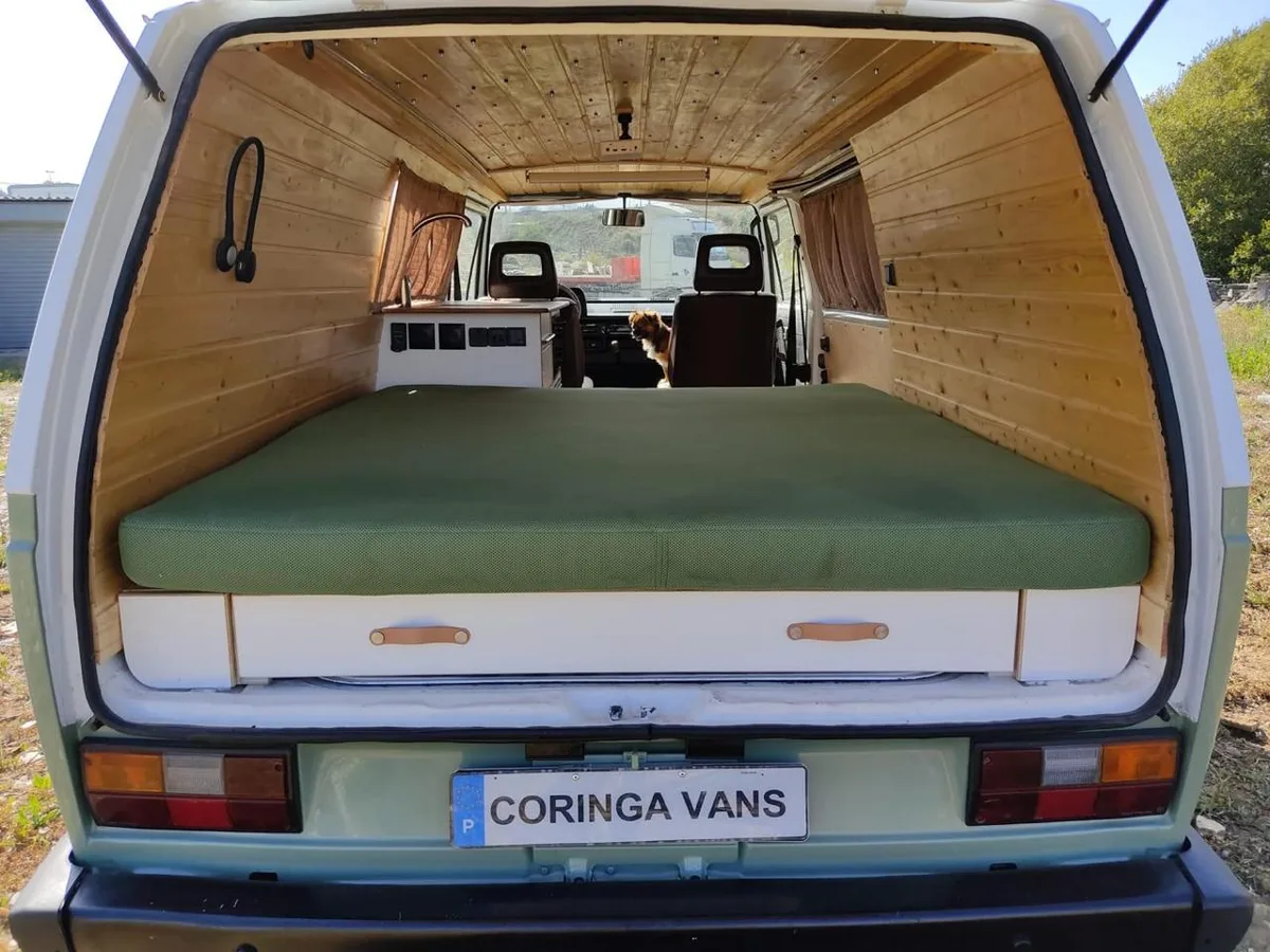View through the rear tailgate with bed extended and wooden drawers