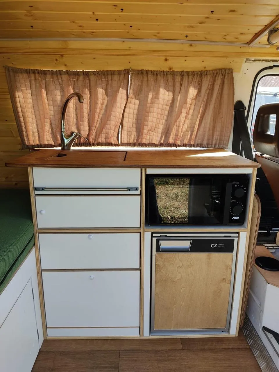 Interior view with pine wood ceiling and recessed lighting