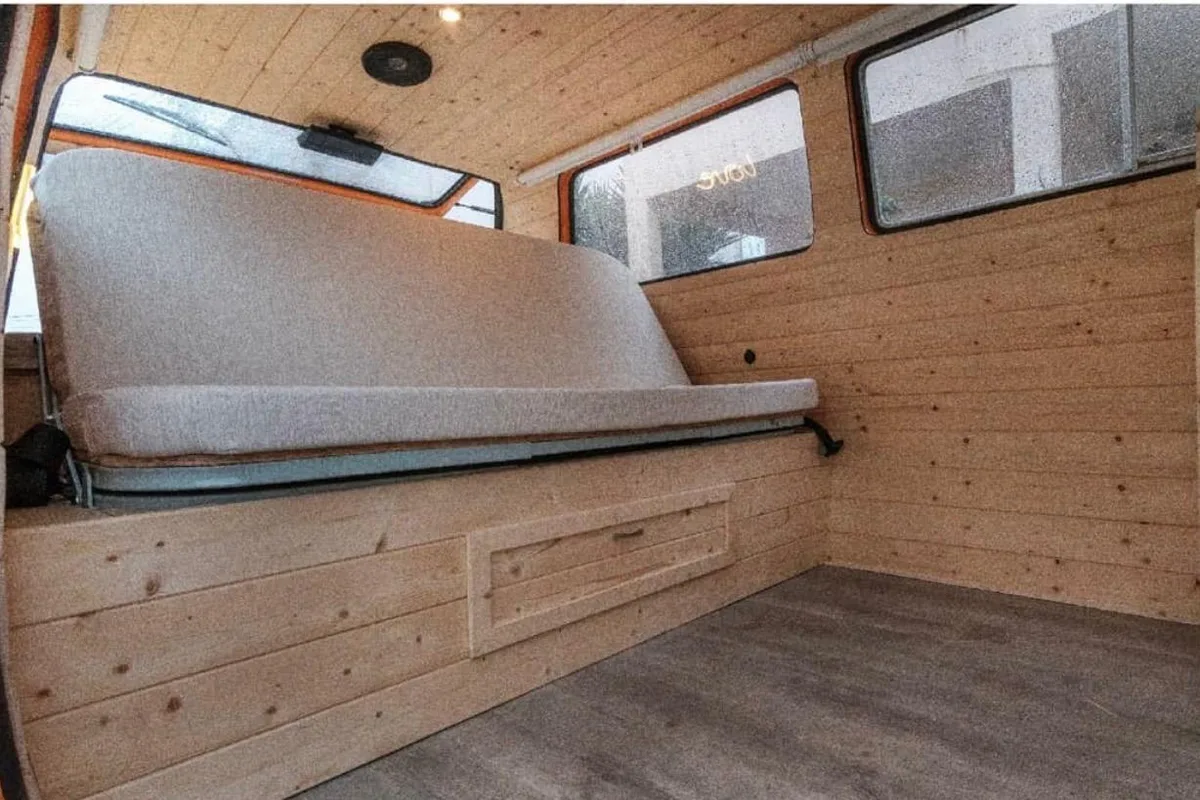 Interior with solid wood bench and natural fabric upholstery