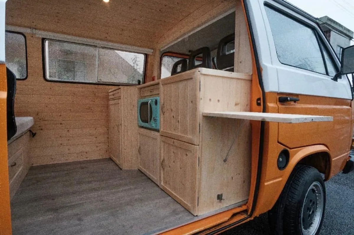 Modular wooden kitchen with mint-green microwave