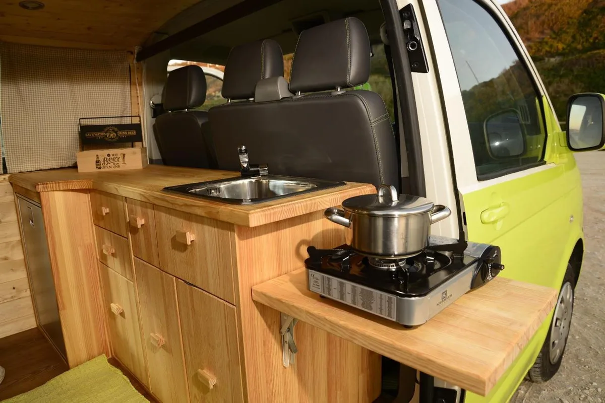 Side kitchen — counter, sink and portable stove